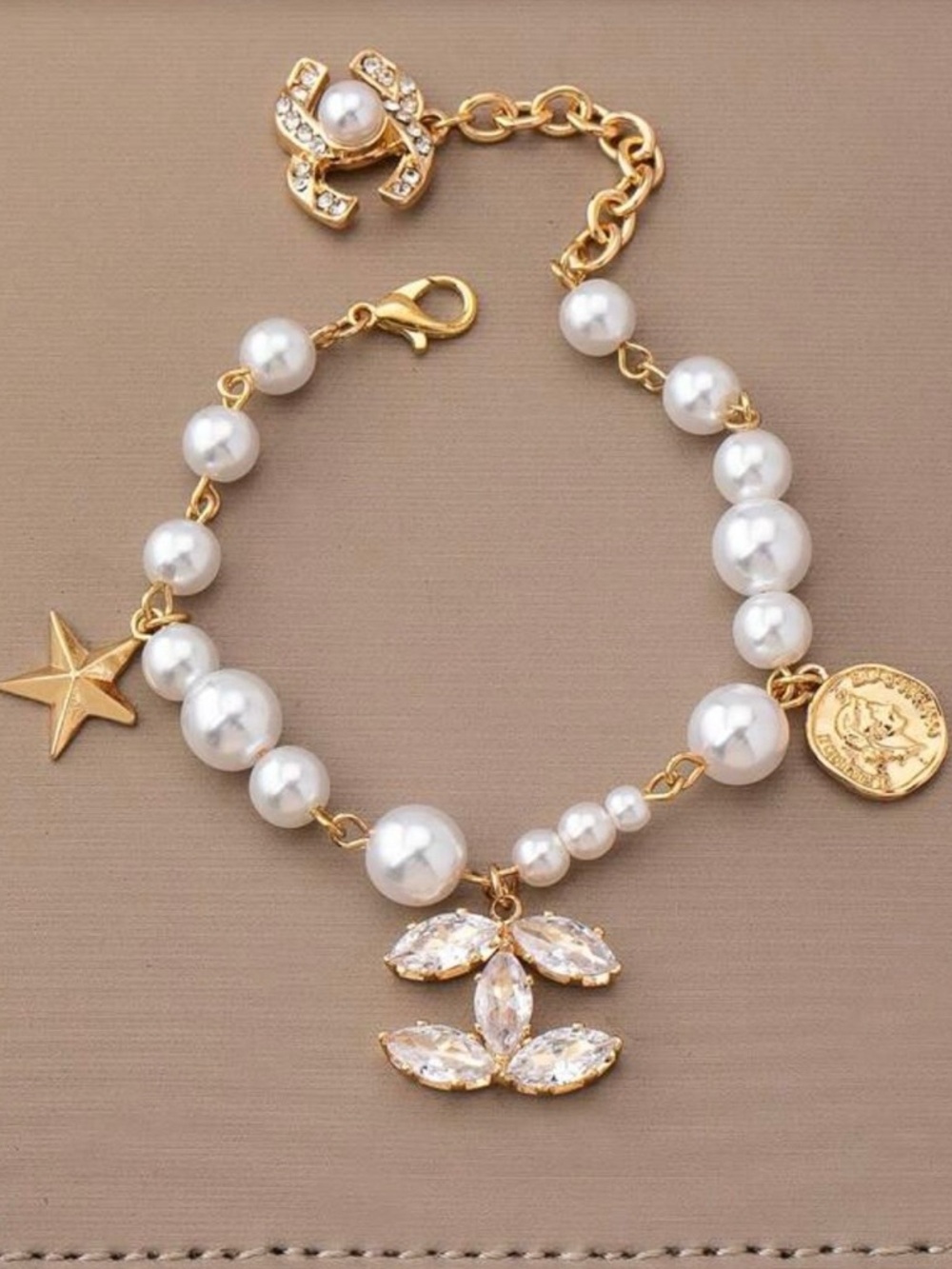 Gold and Pearl Charm Bracelet with Crystal Pendant